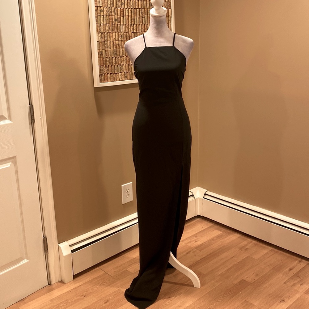Donna Mizani Black Formal Gown with Tall Side Slit and Criss Cross Back